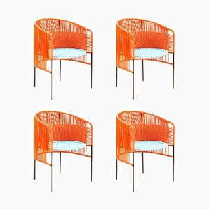 Silla de comedor Caribe en naranja y menta de Sebastian Herkner. Juego de 4