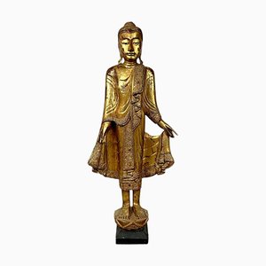 Scultura di Buddha in piedi, anni '60, in legno con foglia d'oro