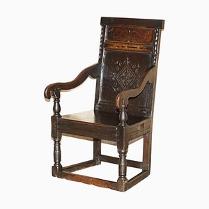 17th Century English Jacobean Hand Carved Oak Armchair with Tudor Panelling