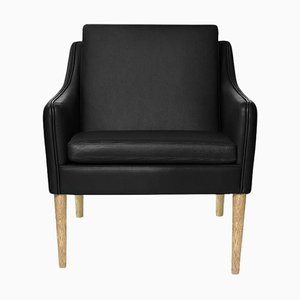 Mr. Olsen Lounge Chair in Smoked Oak and Black Leather by Warm Nordic