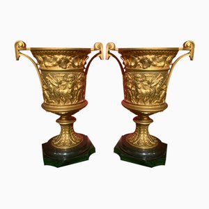 French 18th Century Louis XVI Ormolu Vases with Handles and Relief Putto on Black Belgian Marble Bases, Set of 2