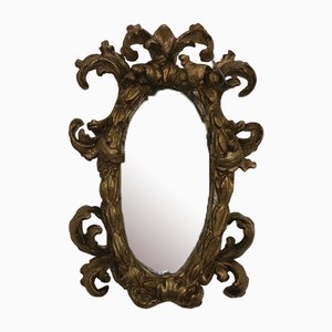 Specchio barocco della metà del XVIII secolo con cornice in legno intagliato e dorato