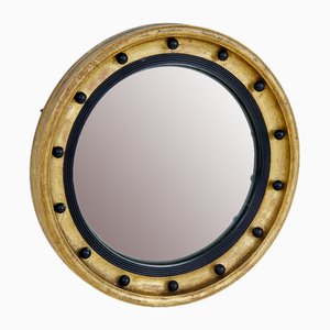 Specchio antico convesso ebanizzato e dorato