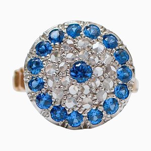 Ring aus Roségold und Silber mit weißen und blauen Steinen