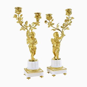 Candelabros de dos brazos Luis XVI Napoleón III en bronce dorado. Juego de 2