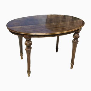 Tavolo basso ovale in legno di noce finemente intagliato, anni '50