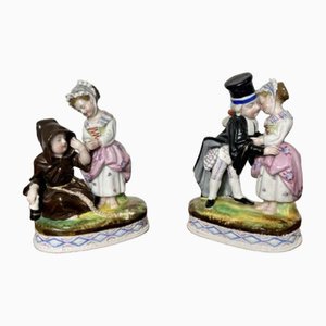 Figuras continentales victorianas de porcelana, década de 1880. Juego de 2