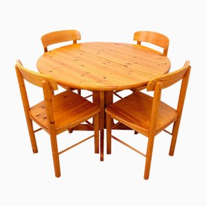 Mesa de comedor y sillas redondas de pino, años 70. Juego de 5