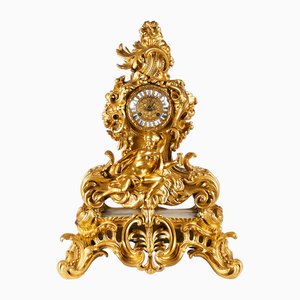 Orologio da camino placcato in oro, XIX secolo