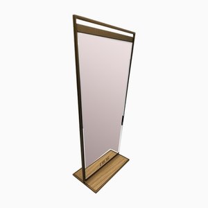 Espejo de metal dorado y base de madera de Christian Dior