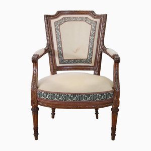 Armchair in Carved Walnut, 18th Century