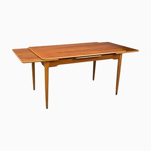 Mesa de comedor extensible de madera de teca y haya, años 60