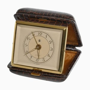 Reloj despertador de viaje de latón y piel de serpiente sintética de GW, Alemania, años 50