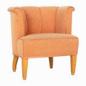 Sessel aus orangefarbenem Stoff