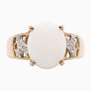 Anello in oro 9 carati con opale cabochon e diamanti, anni '80
