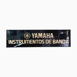 Insegna Yamaha Musical Instruments nera e dorata, anni '80