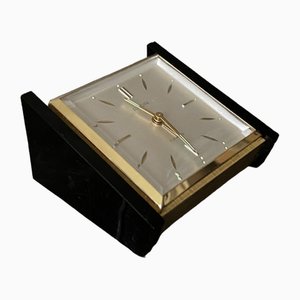 Reloj de mesa Mid-Century modernista en negro y dorado, años 60