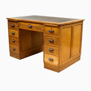 Early 20th Century Brown Oak Desk in Leather Top with Nine Drawers & Writing Slide