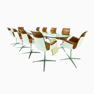 Poltrone FK 6728 4G in pelle cognac di Preben Fabricius e Jørgen Kastholm per Walter Knoll/Willhelm Knoll e un tavolo da pranzo Matteo Grassi in pelle e vetro. 1990, set di 11