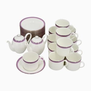 12 tazas de café y sus platillos de porcelana, 2 teteras y 1 jarra de leche del Hotel Cap Eden Roc, años 80. Juego de 15