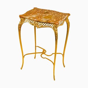 Mesa de estilo Luis XV de bronce dorado con tablero de mármol, siglo XIX