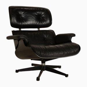 Poltrona vintage in pelle nera di Charles & Ray Eames per Vitra