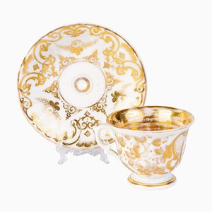 Taza de té y platillo alemanes de porcelana dorada de KPM Berlin, década de 1840. Juego de 2