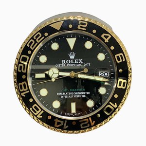 Reloj de pared maestro Oyster Perpetual GMT en dorado y negro de Rolex