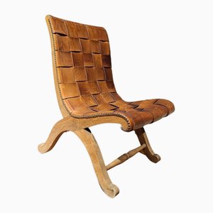 Silla inferior Mid-Century de cuero y madera de Pierre Lottier, años 60