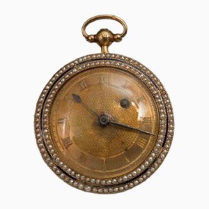 Orologio da taschino a forma di galletto con cassa in pelle e perle, XIX secolo in oro e smalto