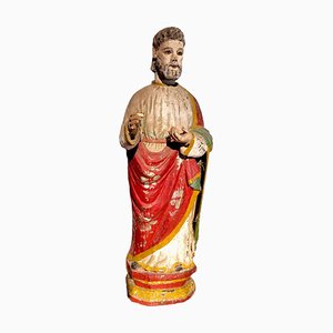 Antica figura di un santo religioso scolpito a mano in legno con resti in policromia, XIX secolo