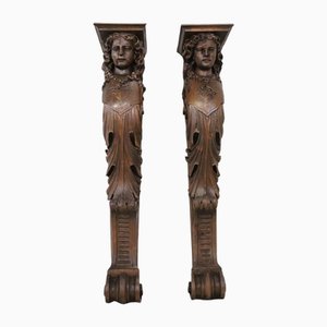 Pedestales para cariátides de nogal tallado de principios del siglo XX. Juego de 2