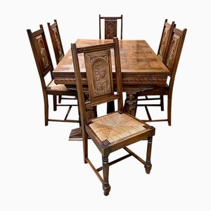 Mesa y sillas de comedor breton de roble, años 50. Juego de 7