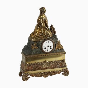 Reloj de péndulo de bronce dorado