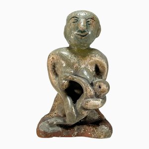 Figura viativa de Sawankhalok escondida en terracota