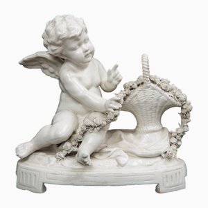 Porcelain Sculpture Depicting Putto with Basket of Flowers from Capodimonte, 20th Century