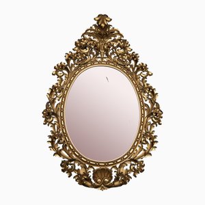 Antique Florentine Mirror of Oval Shape in Gilded and Carved Wood, Early 20th Century