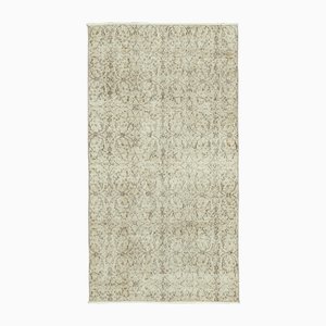 Alfombra vintage beige tejida a mano