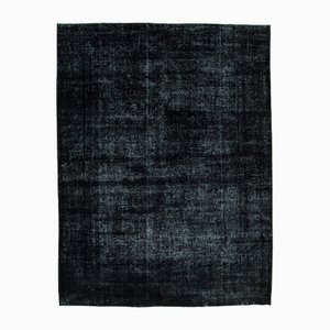 Alfombra grande hecha a mano de lana sobreteñida en negro