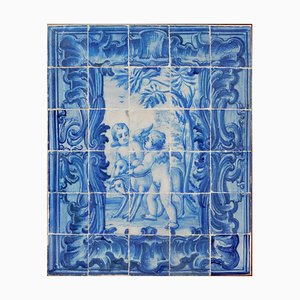 Panel de azulejos portugueses del siglo XVIII con decoración de ángeles. Juego de 30