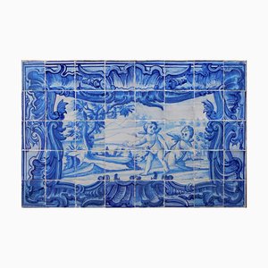 Panel de azulejos portugueses del siglo XVIII con decoración de ángeles que juegan. Juego de 40
