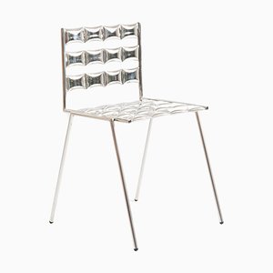 Silla Cosmic de acero inoxidable de Metis Design Studio