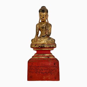 Artista birmano, Mandalay Buddha seduto, metà XIX secolo, legno dorato e lacca