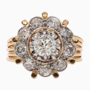 Anillo Daisy de diamantes en platino y oro amarillo de 18 kt, años 40