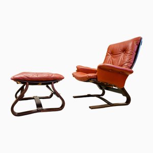 Sillón danés vintage y reposapiés de cuero Cocnag de Komfort, años 70. Juego de 2