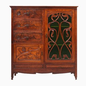 Art Nouveau Cabinet in Oak with Green Glass Door and Floral Decoration, France, 1910s