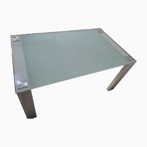 Mesa de comedor moderna de cristal con estructura de hierro