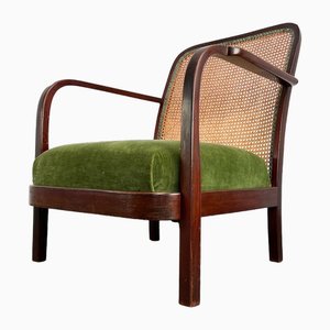 Vintage Armlehnstuhl aus Rattan von Thonet, 1950er