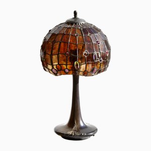 Lámpara modernista de bronce y vitral, años 20