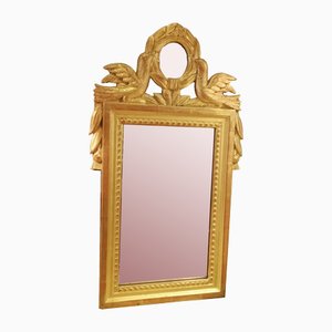 Specchio da parete in legno dorato intagliato con decorazioni in oro